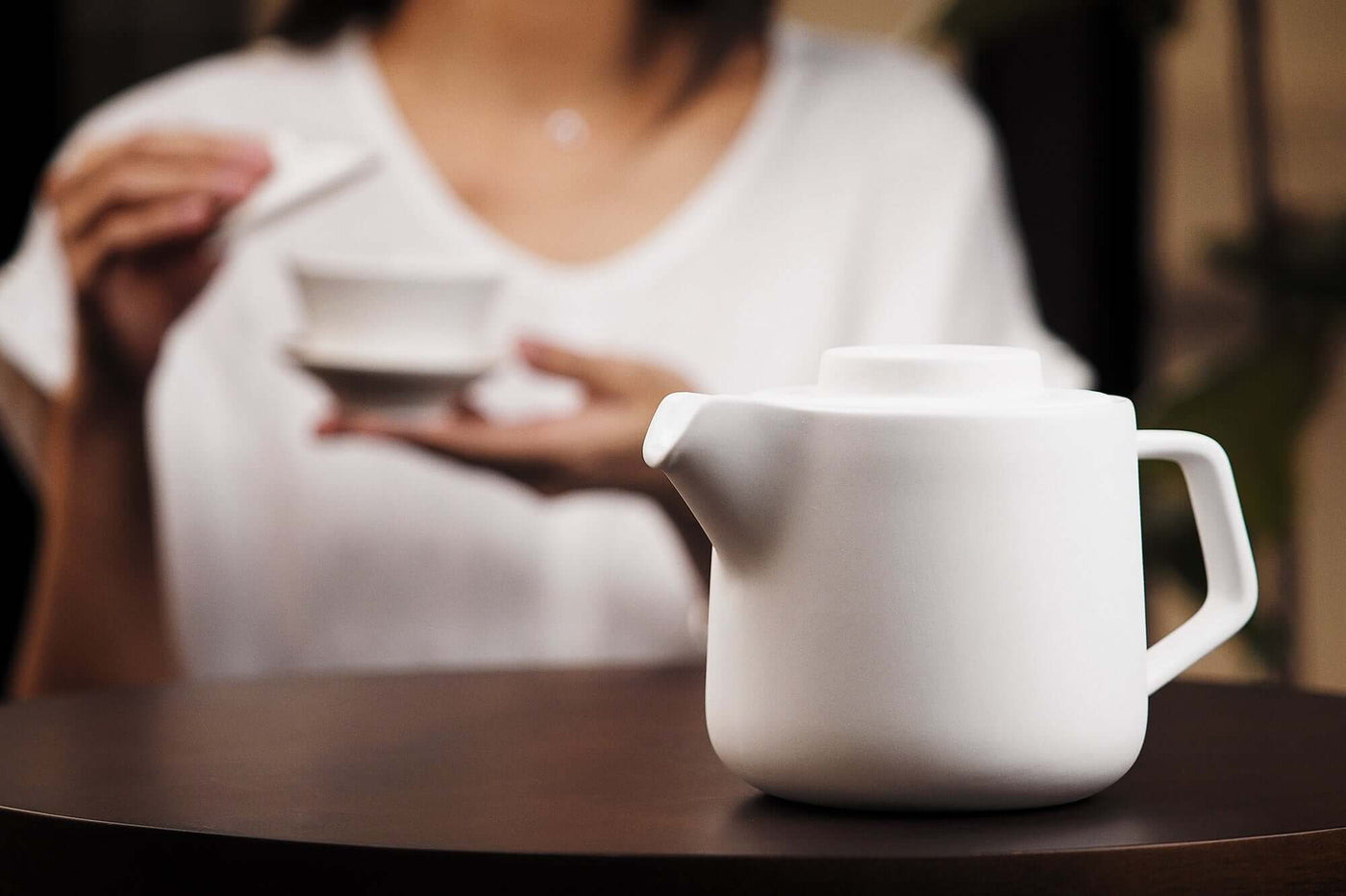 Elegant Duo Pot with dripless spout and matte finish, featuring contemporary award-winning design, on wooden table.