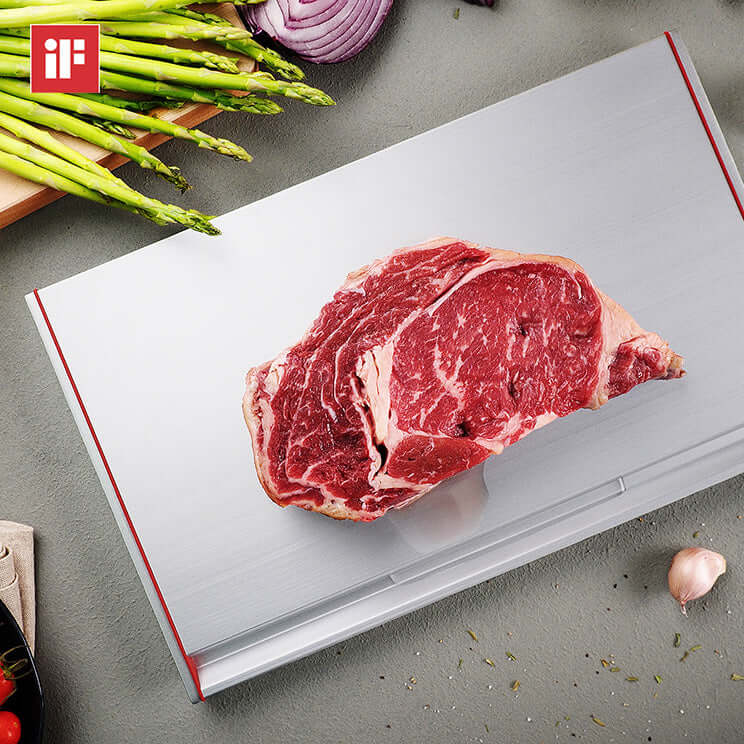 ThawTHAT! Modern defrosting tray with steak, featuring angular design, heat fins, and drip channel for efficient thawing.